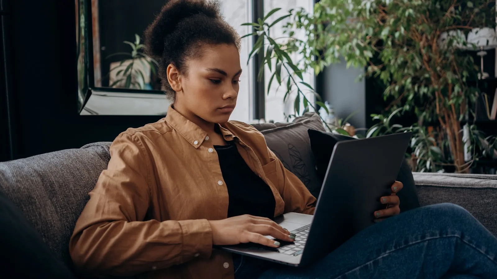 A person managing their accounts on a laptop at home